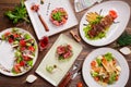 Different salads on wooden table, top view. Royalty Free Stock Photo