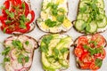 Different sandwiches with vegetables and microgreens on toast bread on a light background Royalty Free Stock Photo