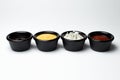 Different sauces in assortment in black sauces Royalty Free Stock Photo