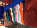 Different scarfs in several colors and textiles for sale at a market stand of Otavalo, ecuador Royalty Free Stock Photo