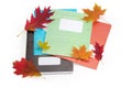 Different school exercise books with several autumn leaves Royalty Free Stock Photo