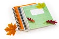 Different school exercise books with spiral binding and autumn leaves Royalty Free Stock Photo