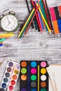 Different school supplies on the wooden background Royalty Free Stock Photo