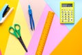 Different school tools on colorful paper copy space background Royalty Free Stock Photo