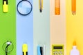 Different school tools on colorful paper copy space background Royalty Free Stock Photo