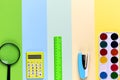 Different school tools on colorful paper copy space background Royalty Free Stock Photo