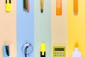 Different school tools on colorful paper copy space background Royalty Free Stock Photo