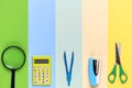 Different school tools on colorful paper copy space background Royalty Free Stock Photo