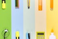 Different school tools on colorful paper copy space background Royalty Free Stock Photo