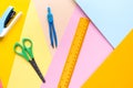 Different school tools on colorful paper copy space background Royalty Free Stock Photo