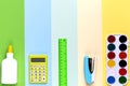 Different school tools on colorful paper copy space background Royalty Free Stock Photo