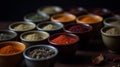 Different seasonings in cups. Spice background on the table