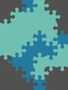 Different shades of blue color jigsaw puzzles designs on solid sheet of wallpaper