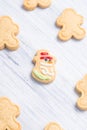 Different shaped cookies on a light gray background with a cheerful snowman in the center Royalty Free Stock Photo