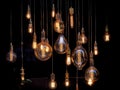 Different shaped vintage light bulbs on black background