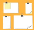 Different sheets of note papers and paper clips on orange background Royalty Free Stock Photo