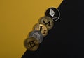Different shining cryptocurrency coins, crypto currency. Bitcoin, litecoin, ethereum, monero and NEO on yellow and black