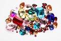 Different shiny gemstones on white background, top view Royalty Free Stock Photo