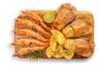 Different shrimps: Spiked shrimp-bear Sclerocrangon salebrosa and king prawn with croutons, grilled lime and rosemary on wooden Royalty Free Stock Photo