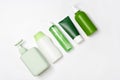 Different size and shapes containers for cleanser toner tonic conditioner, soap and shampoo on white background. Natural organic