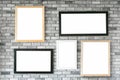 Different size and style empty photo frames on white concrete wa Royalty Free Stock Photo