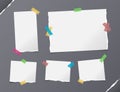 Different size white note, notebook, copybook sheets, strips stuck with colorful sticky tape on gray background with Royalty Free Stock Photo