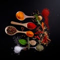 Different size of wooden spoons filled with spices. Salt, pepper and herbs scattered around. Top view. Generative AI Royalty Free Stock Photo