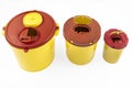 Different sizes of Medical waste rubbish bins 1.3, 2, 3, 5 liter. Yellow biohazard medical contaminated and sharp clinical waste