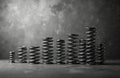 Different sizes of metal springs in black and white. Springs are arranged in a row on a grey background. Various sizes of coiled Royalty Free Stock Photo