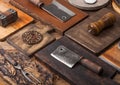 Different sizes and shapes kitchen chopping boards on wooden background with meat hatchets, fork and knife and other utensils. Top Royalty Free Stock Photo