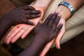 Different skin colors. Diversity. African children is touching a tourist`s hands. Royalty Free Stock Photo