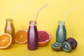 Different smoothies or juices in bottles, healthy diet food concept.