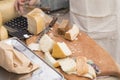 Different sorts of cheese wheels at a market Royalty Free Stock Photo