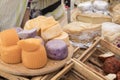 Different sorts of cheese wheels at a market Royalty Free Stock Photo