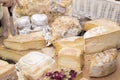 Different sorts of cheese wheels at a market Royalty Free Stock Photo