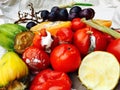 Different sorts of rotten fruits and vegetables on gray paper Royalty Free Stock Photo