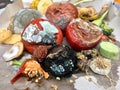 Different sorts of rotten fruits and vegetables on gray paper Royalty Free Stock Photo