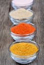 Different spices in a bowls on old table Royalty Free Stock Photo