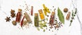 Different spices, dry kitchen herbs and seeds in glass vials for tasty meals Royalty Free Stock Photo