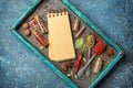 Different spices, dry kitchen herbs and seeds for tasty meals and mock-up of craft paper notebook Royalty Free Stock Photo