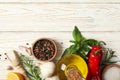 Different spices and herbs on wooden background, top view Royalty Free Stock Photo