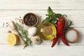 Different spices and herbs on white wooden background, top view Royalty Free Stock Photo