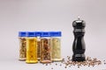 Different spices in jars and black pepper Royalty Free Stock Photo