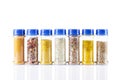 Different spices jars and pepper mill Royalty Free Stock Photo