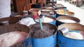 Different spices on a local asian market in steel barrels