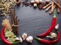 Different spices on rocked table.