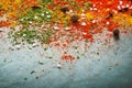 Different spices scattered on the table, red paprika powder, turmeric, salt, cloves, pepper. Selective focus Royalty Free Stock Photo