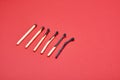 Different stages of match burning red background Royalty Free Stock Photo