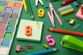 Different stationery on green background, flat lay with space for text. Back to school Royalty Free Stock Photo