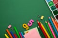 Different stationery on green background, flat lay with space for text. Back to school Royalty Free Stock Photo